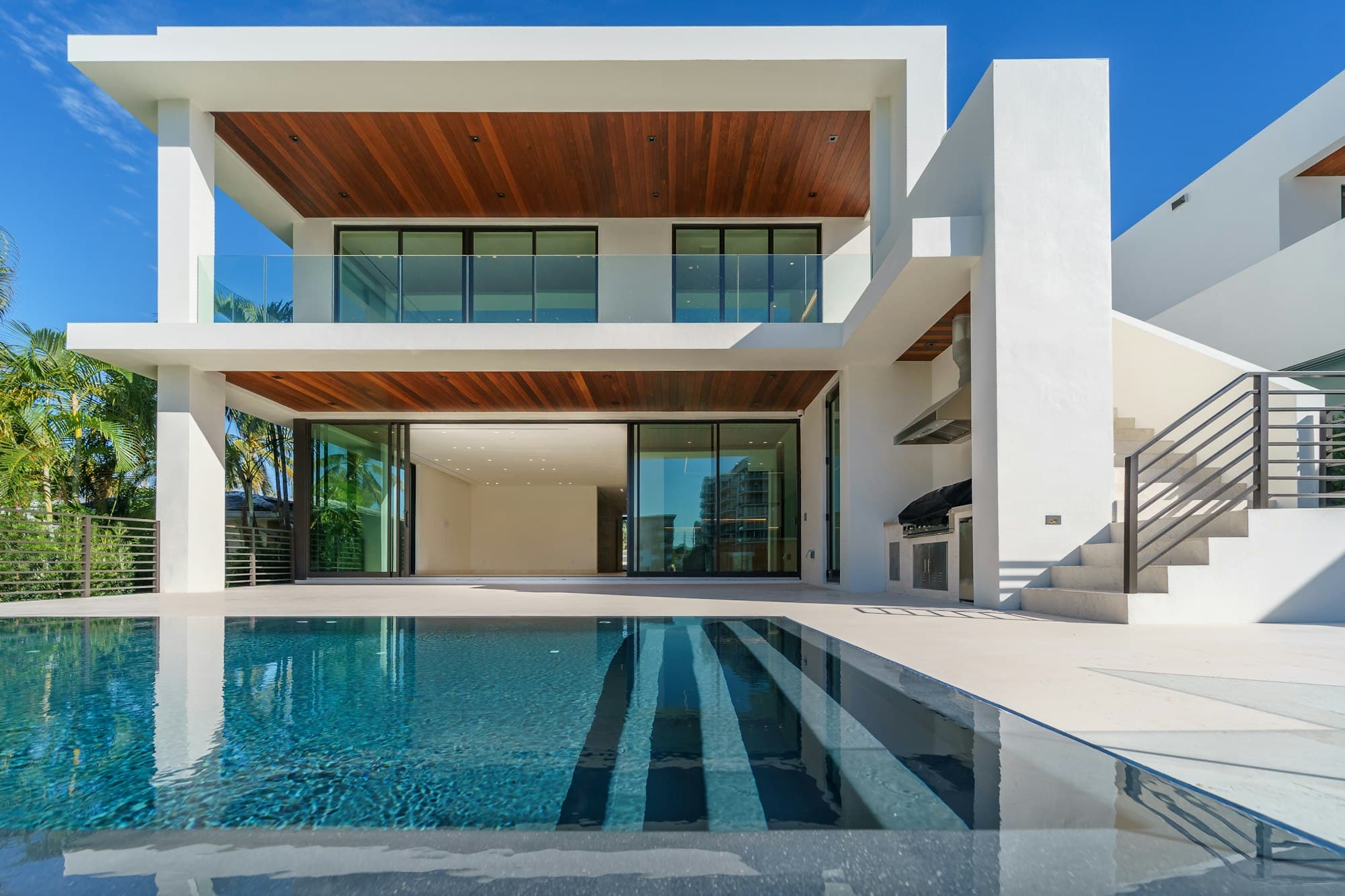 White contemporary villa with a shaded terrace, used to suggest a cared-for home